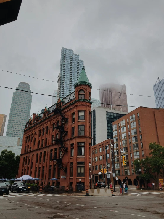 a city street filled with lots of tall buildings, a photo, pexels contest winner, vancouver school, grey skies rain, brick building, background image