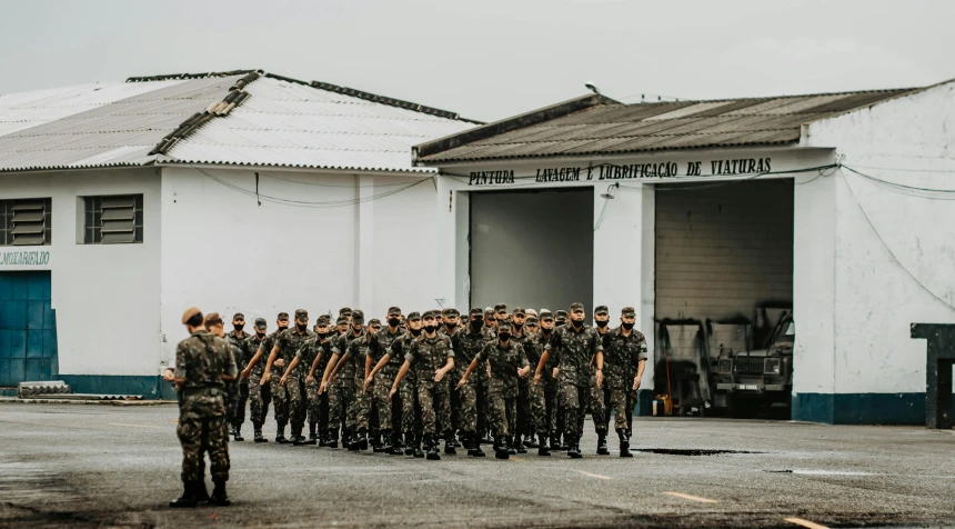 a group of soldiers standing in a line in front of a building, pexels contest winner, brazil, 🚿🗝📝, azores, softair center landscape