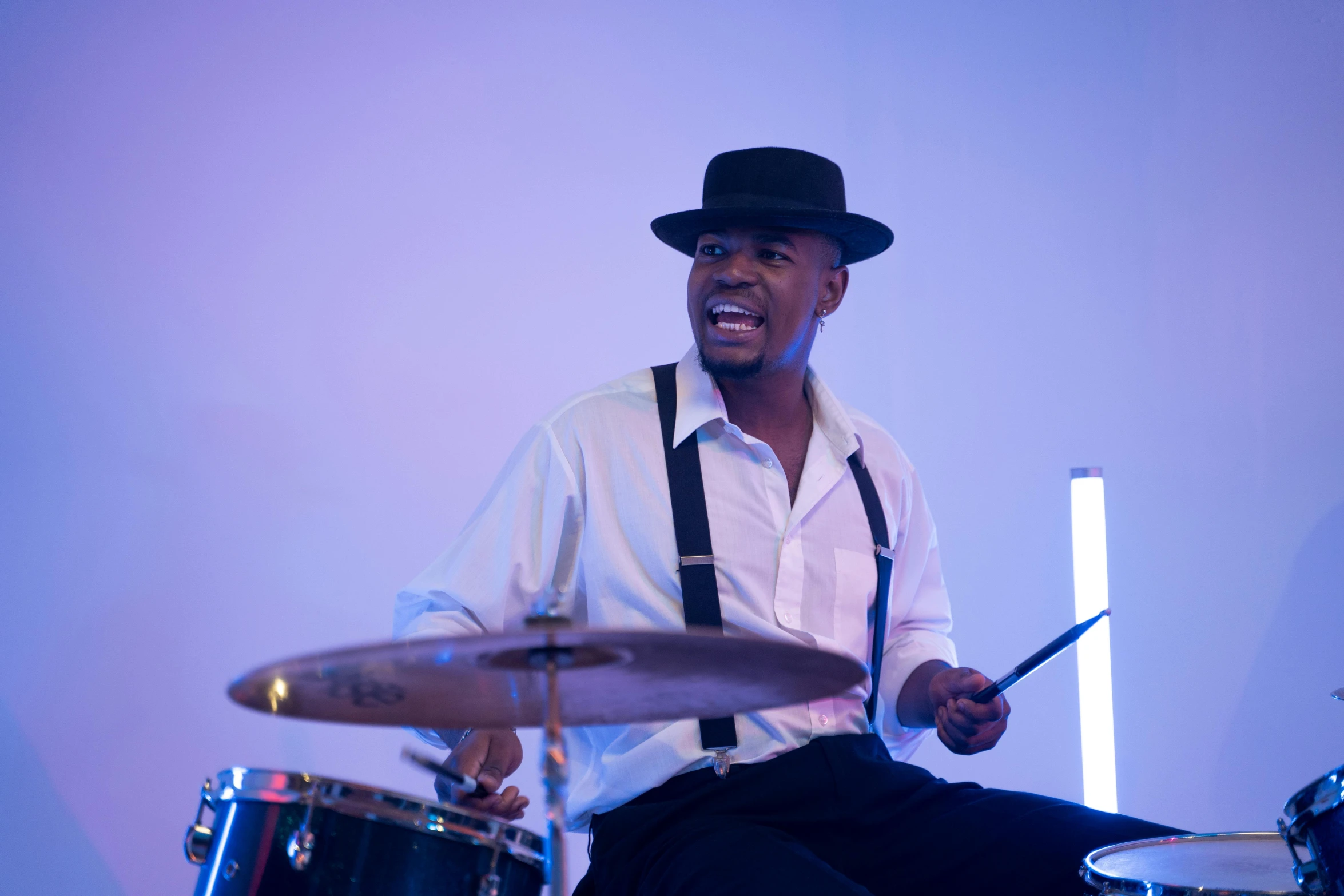 a man sitting on top of a drum set, a suited man in a hat, aaron brooks, childish look, wedding