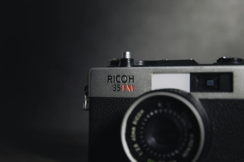a close up of a camera on a table, by Dan Frazier, unsplash contest winner, photorealism, on a gray background, shot on nicon camera, classic gem, pochi iida