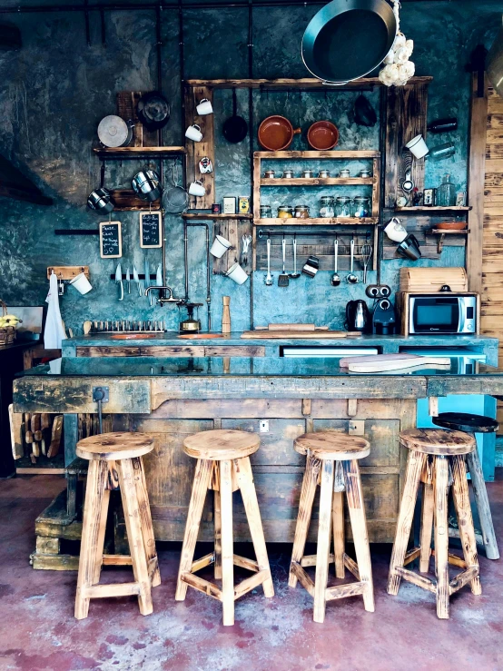 a kitchen filled with wooden stools next to a counter, trending on unsplash, renaissance, rusted walls, brown and cyan blue color scheme, pub, furniture concept photo!!