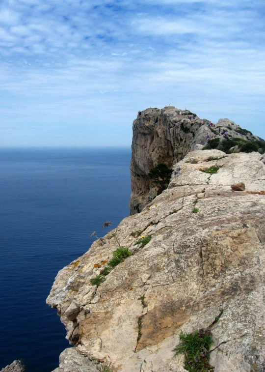 a man standing on top of a cliff next to the ocean, inspired by Fede Galizia, les nabis, slide show, ibiza, dramatic”