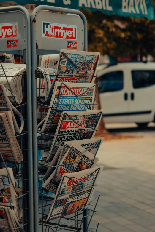 a newspaper stand on the side of the street, by Niko Henrichon, pexels contest winner, video, sunny morning, multiple stories, today\'s featured photograph 4k