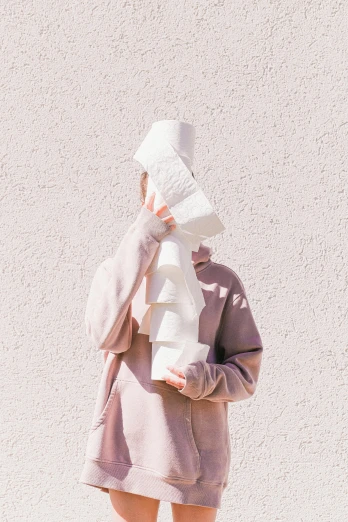 a woman with a towel on her head, an abstract sculpture, by Sara Saftleven, unsplash, conceptual art, paper cup, white and light-pink outfit, streetwear, stacked image