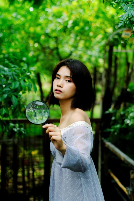 a woman in a white dress holding a magnifying glass, unsplash, portrait of a japanese teen, ((portrait)), in green forest, 5 0 0 px models