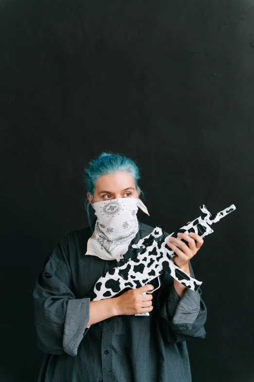 a woman with blue hair is holding a giraffe, inspired by Elsa Bleda, unsplash, airsoft gun, vantablack gi, cow, bandanas