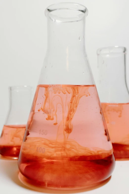 three vases filled with liquid sitting next to each other, analytical art, pink slime everywhere, scientific equipment, promo image, up-close