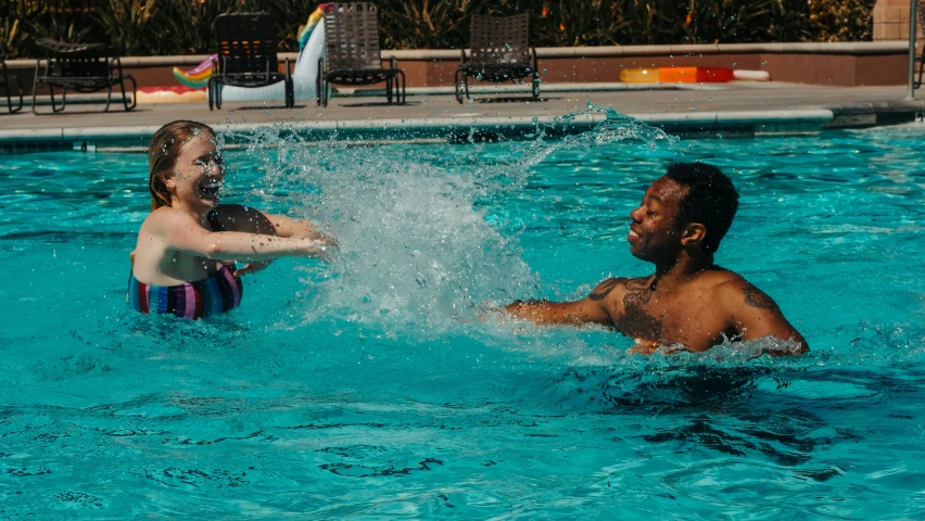 a man and a little girl playing in a pool, pexels contest winner, mix of ethnicities and genders, thumbnail, splash image, college