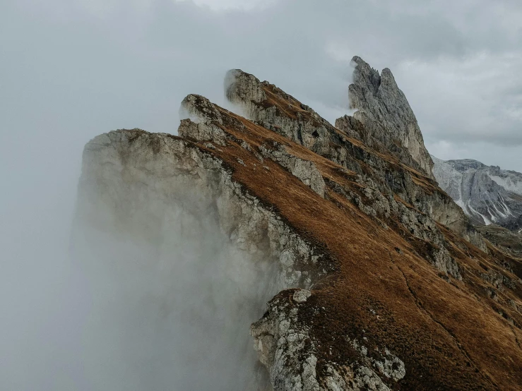 a group of people standing on top of a mountain, an album cover, by Emma Andijewska, pexels contest winner, romanticism, limestone, moist foggy, unsplash 4k, brown