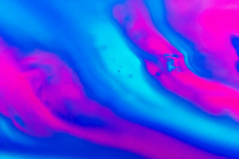 a close up of a red and blue liquid, pexels, generative art, pink and blue neon, shades of aerochrome, ( ( vibrating colors ) ), turbulence