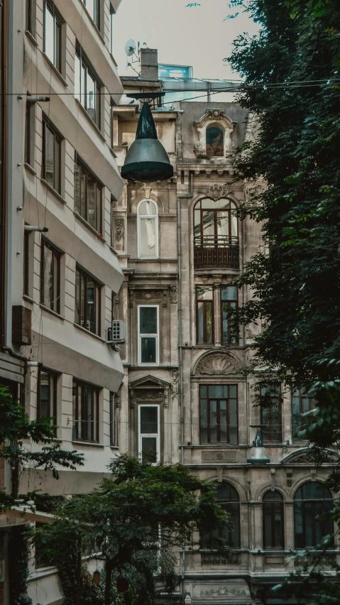 a couple of buildings that are next to each other, a photo, by Konrad Witz, pexels contest winner, art nouveau, apartment, gif, classicism style, located in hajibektash complex