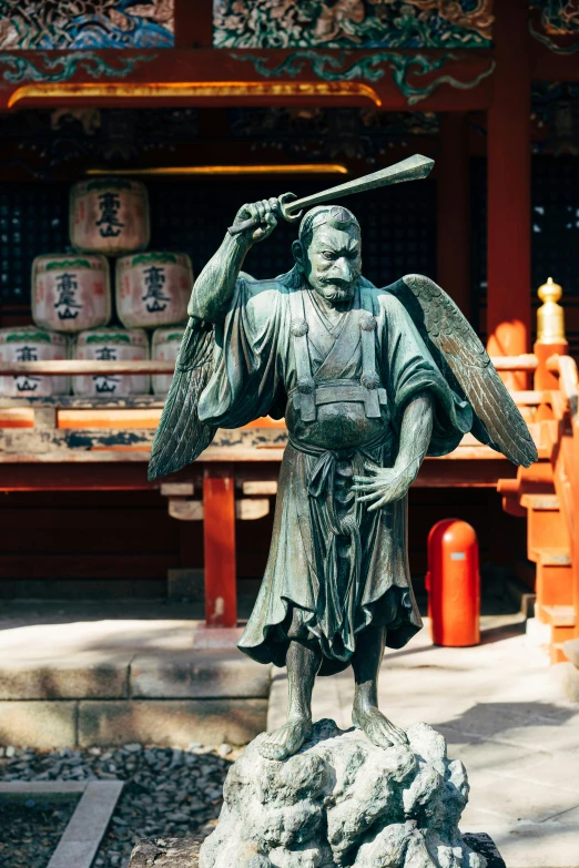 a statue of a man holding a baseball bat, a statue, inspired by Kanō Sanraku, shin hanga, in a temple, angel statues, samurai flight suit, japan deeper travel exploration