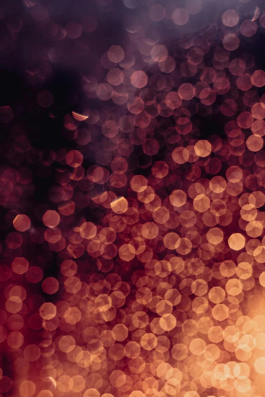 a blurry image of lights in the dark, an album cover, pexels, pointillism, deep purple and orange, bubbly, embers, hazy