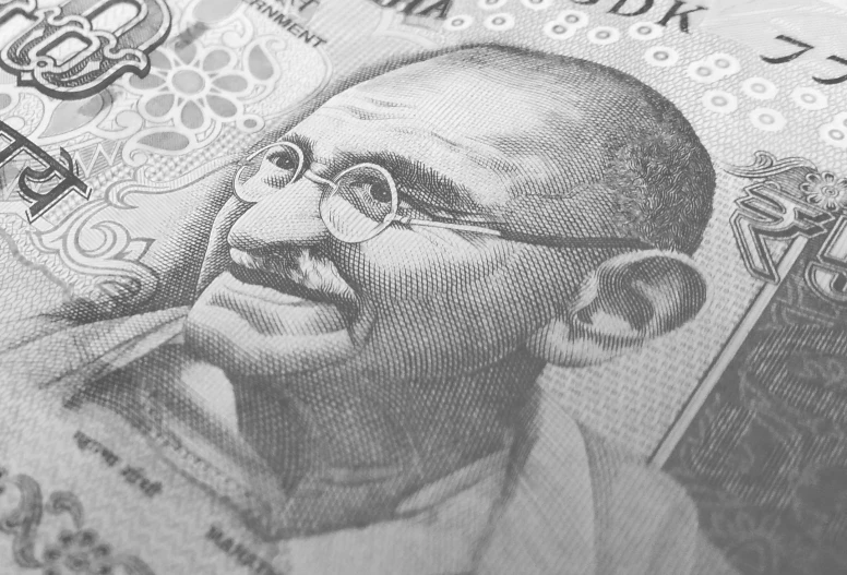 a close up of a bank note with a man's face on it, a stipple, inspired by Bapu, pixabay, shot on sony a 7, civ ghandi, thumbnail, high detail shot