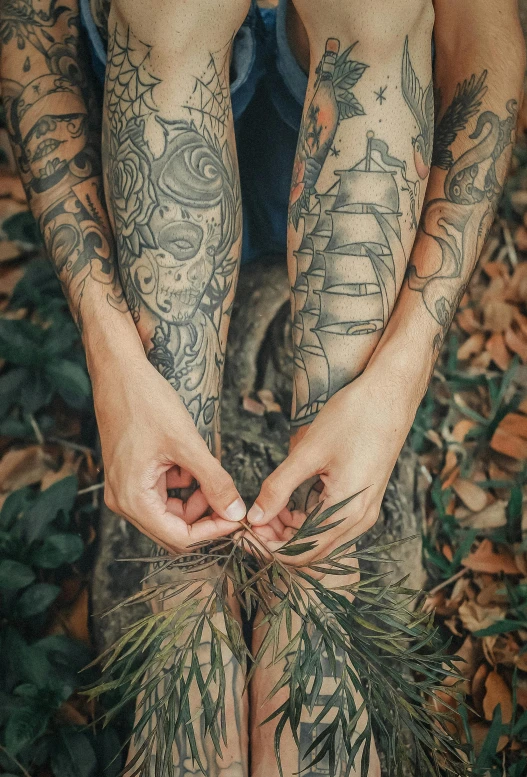 a close up of a person with tattoos on their legs, pexels contest winner, symbolism, amongst foliage, natural hands and arms, tattoo graphics, multiple stories