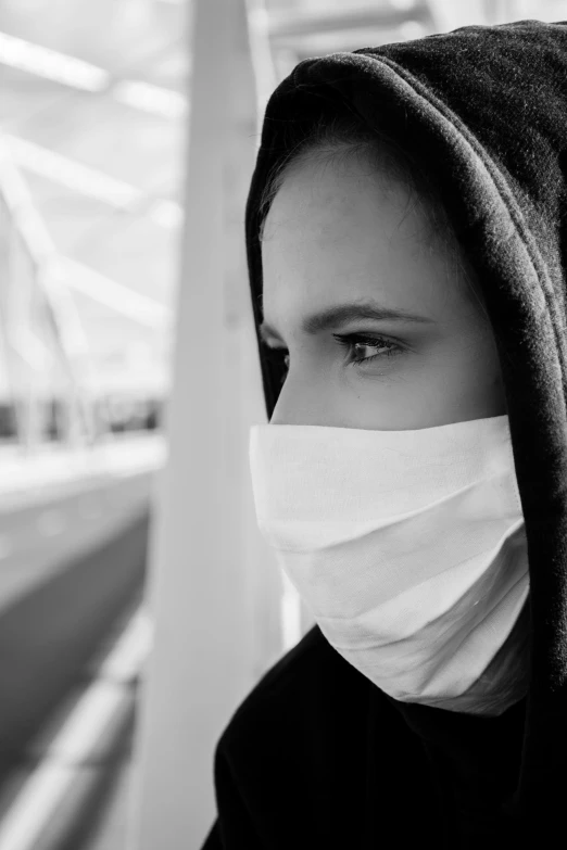 a black and white photo of a person wearing a mask, girl wearing hoodie, coronavirus, monochrome:-2, picture