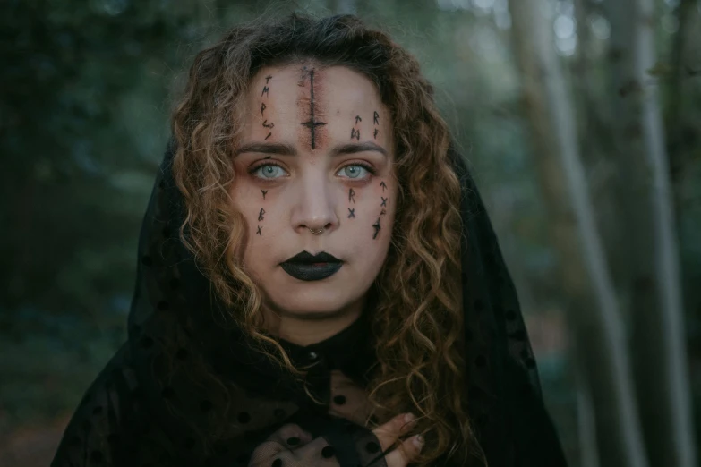 a woman with a cross painted on her face, pexels contest winner, gothic art, witchy clothing, with haunted eyes and curly hair, funeral veil, vecna from stranger things