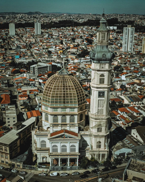 a view of a city from a bird's eye view, a colorized photo, pexels contest winner, baroque, bispo do rosario, dome, profile image, two towers