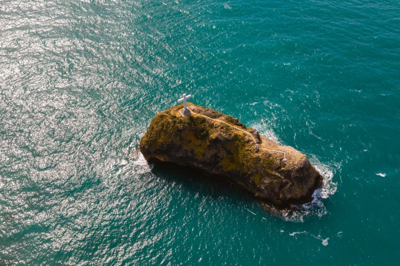 a large rock in the middle of the ocean, pexels contest winner, golden bay new zealand, helicopter view, thumbnail, aphrodite