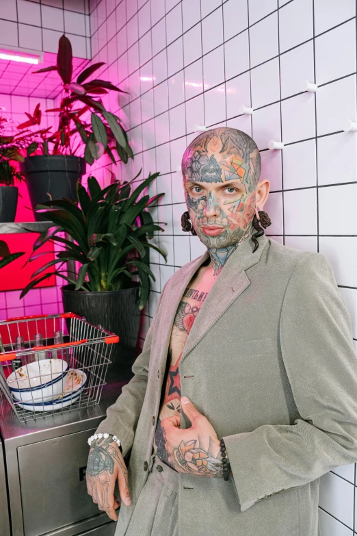 a man that has some tattoos on his face, an album cover, by Jessie Alexandra Dick, trending on pexels, 1990's diner full of zombies, lgbtq, full body tattoo, scaly skin