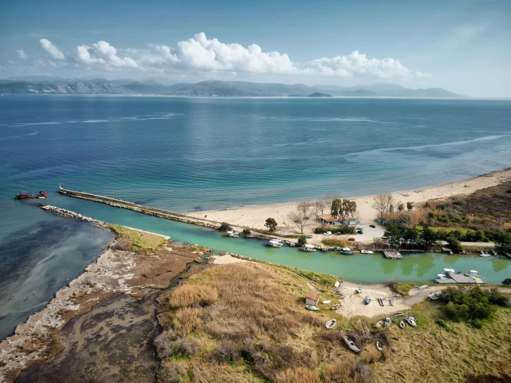 a large body of water next to a beach, by Matthias Stom, pexels contest winner, hurufiyya, greece, inlets, carson ellis, thumbnail