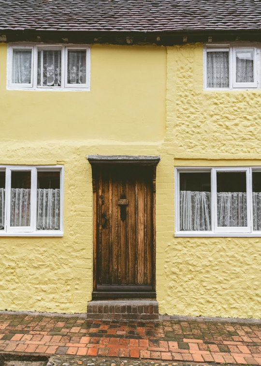 a yellow house with a brown door and windows, pexels contest winner, white, goldilocks, aged 2 5, exterior