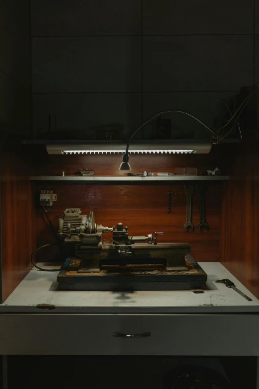 a stove top oven sitting inside of a kitchen, an engraving, unsplash, hyperrealism, made from mechanical parts, museum lighting, ignant, workbench