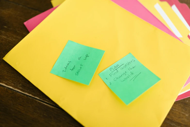 a pile of post it notes sitting on top of a wooden table, yellow and green scheme, thumbnail, recipe, multiple stories