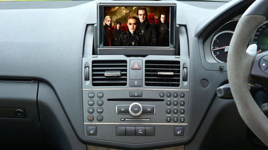 a picture of a group of people in a car, lcd screen, mercedes, television, handheld