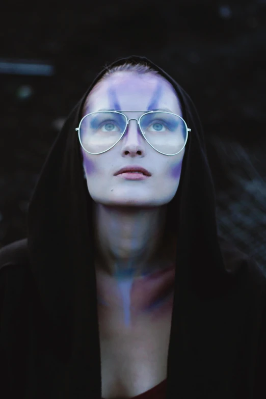 a close up of a person wearing glasses, an album cover, inspired by Rudolf Hausner, pexels contest winner, holography, padme amidala, badass look, fog bionic vogue, portrait of a hipster skeletor