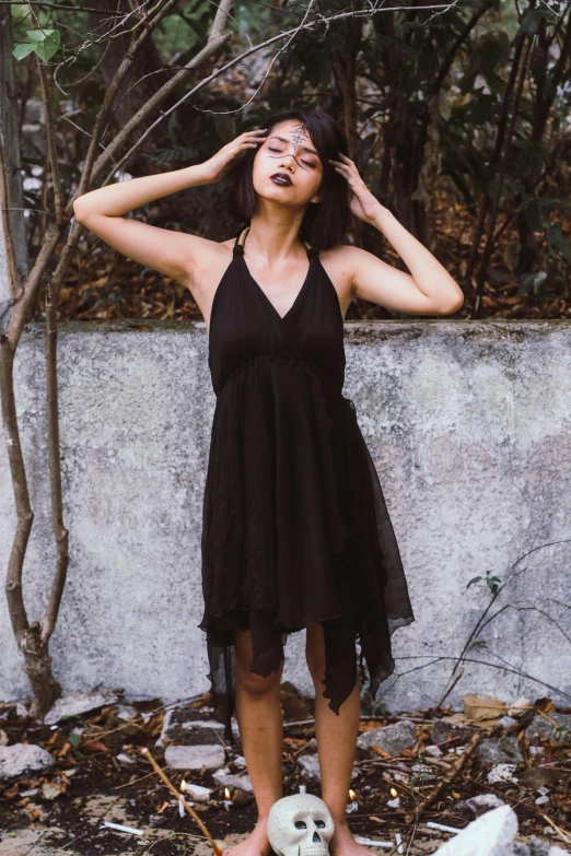 a woman in a black dress standing next to a white dog, unsplash, renaissance, black halter top, gauze angel dress, promo image, wearing a cocktail dress