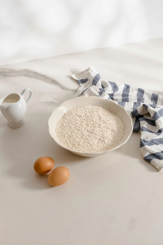 a bowl of oatmeal sitting on top of a table, ivory, detailed product image, kek, lifestyle