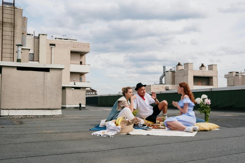 a group of people sitting on top of a roof, a portrait, by Lee Loughridge, unsplash, brutalism, having a picnic, apartment, 15081959 21121991 01012000 4k, cast