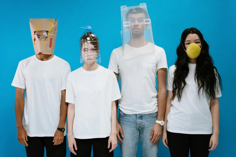 a group of people standing next to each other, an album cover, pexels, glass bubble helmet, facemask, white plastic, thumbnail