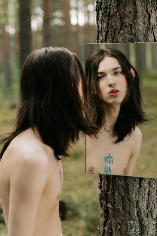 a naked woman standing in front of a mirror, an album cover, inspired by Elsa Bleda, unsplash, hyperrealism, portrait of forest gog, handsome girl, 🚿🗝📝, teen