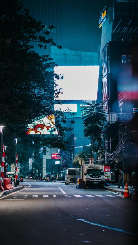 a street filled with lots of traffic next to tall buildings, inspired by Elsa Bleda, unsplash contest winner, pixel art, inside of a tokyo garage, large commercial led screens, city lights made of lush trees, bangkok