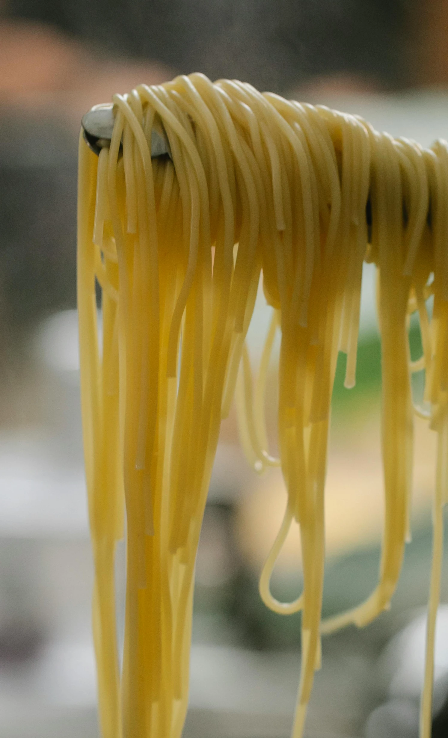 a close up of some noodles on a fork, by Matt Cavotta, renaissance, rain and thick strands of mucus, naples, where a large, hanging