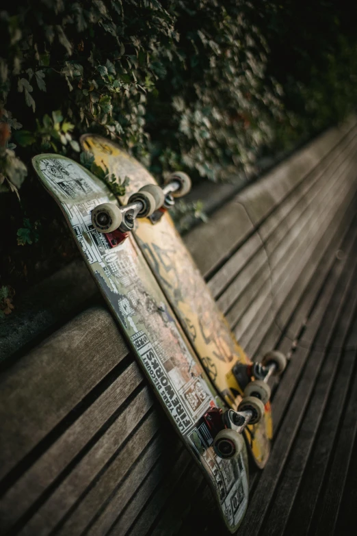 a skateboard sitting on top of a wooden bench, gold, multiple stories, benches, scratched