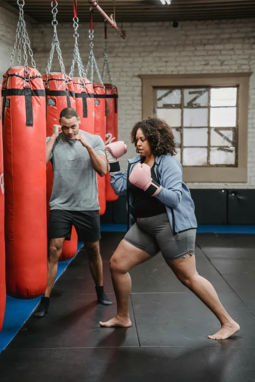 a man and woman boxing in a gym, by Arabella Rankin, plus-sized, profile image, lizzo, square