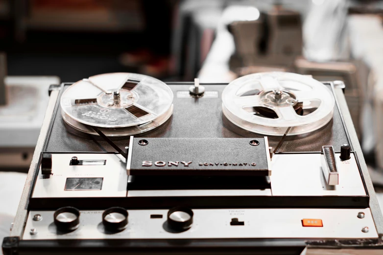 a pair of tape recorders sitting on top of a table, an album cover, unsplash, sony pictures, **cinematic, front closeup, tony taka