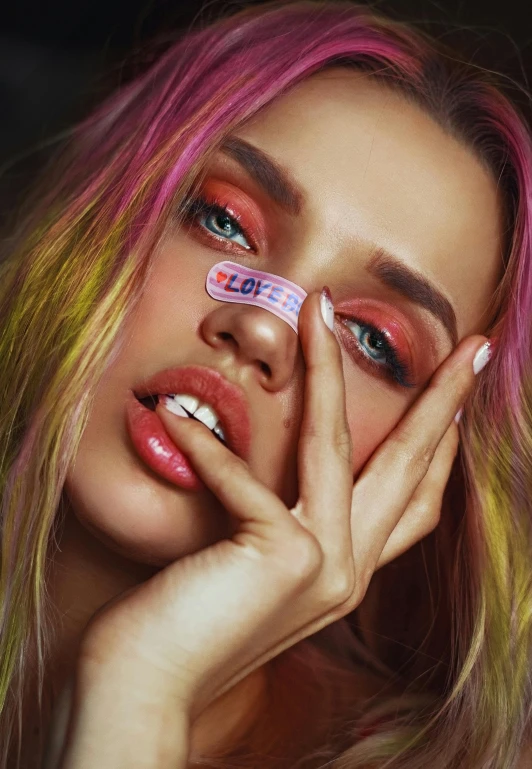 a close up of a person with pink and yellow hair, an album cover, inspired by David LaChapelle, trending on pexels, face like ester exposito, wearing a patch over one eye, anastasia ovchinnikova, painted nails