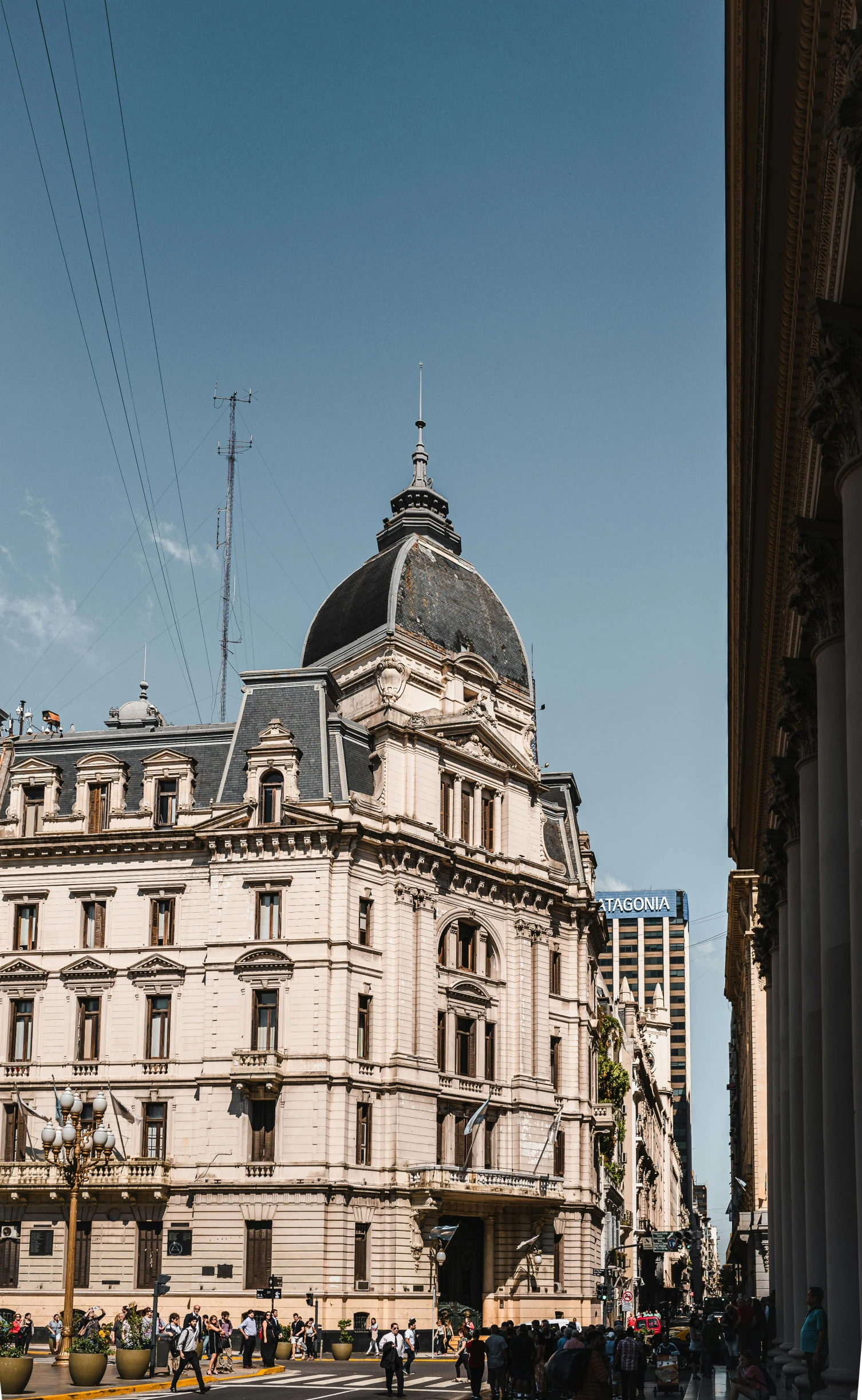 a large white building sitting on the side of a road, inspired by Agustín Fernández, trending on unsplash, in the argentine congress, victorian buildings, view from bottom to top, square