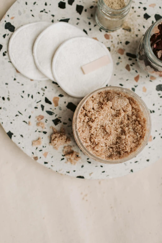 a close up of a plate of food on a table, a picture, dry dirt, detailed product image, taupe, jars