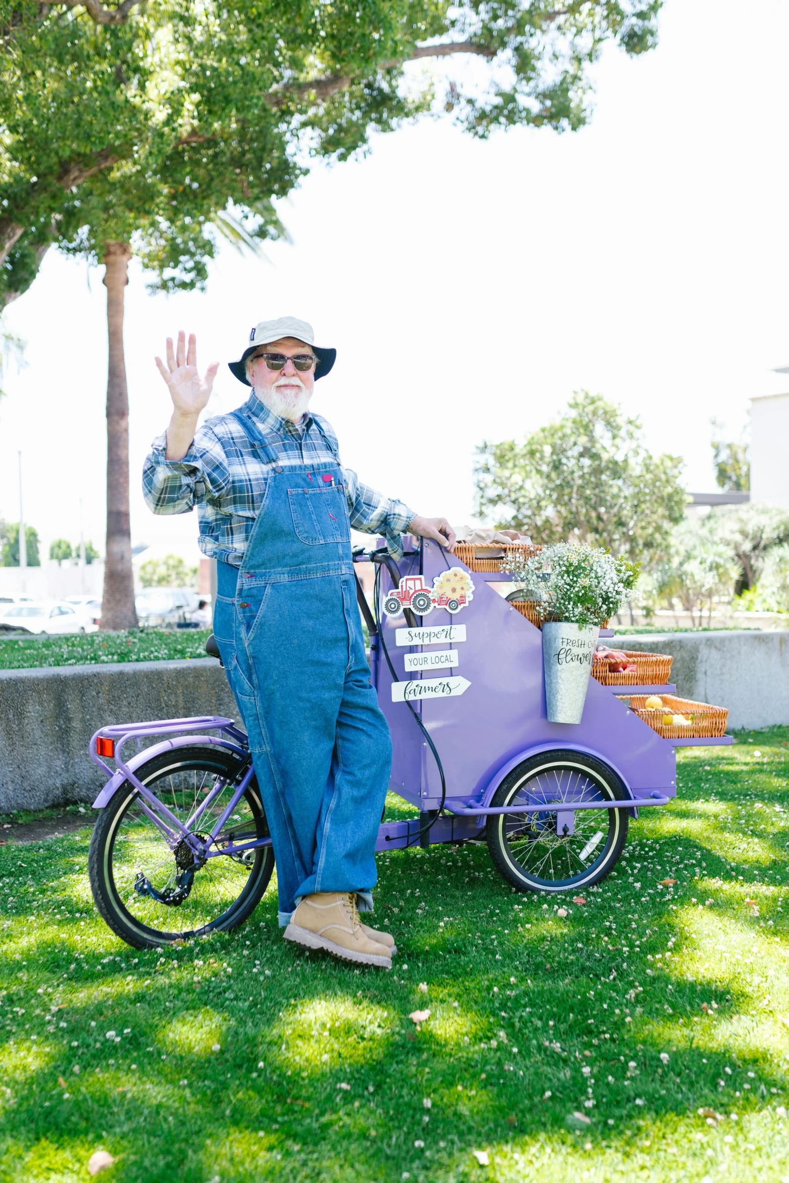 a man in overalls standing next to a purple bike, overalls and a white beard, jc park, giving a thumbs up, wearing farm clothes