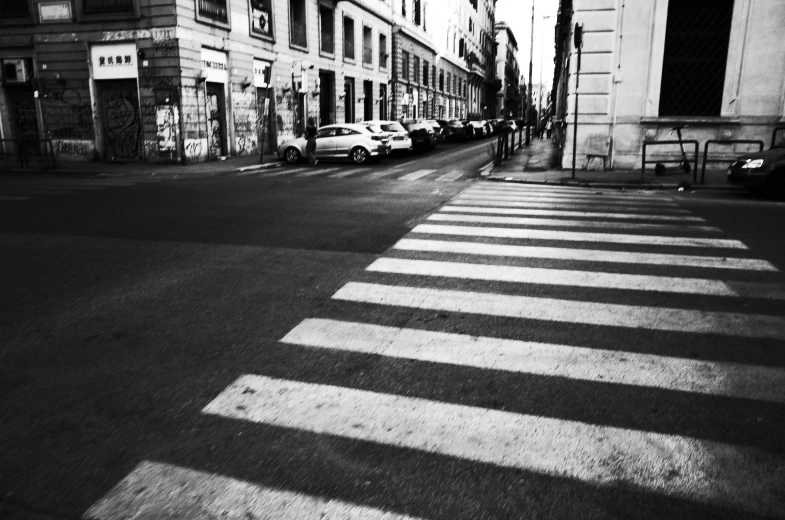 a black and white photo of a crosswalk, by Alessandro Allori, street art, roma, no people, instagram picture, traffic in background