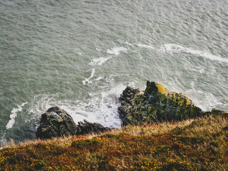 a view of the ocean from the top of a hill, pexels contest winner, wild water, head down, thumbnail, pembrokeshire