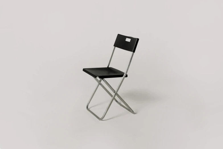 a black chair sitting on top of a white floor, profile image, metal, less detailing, item