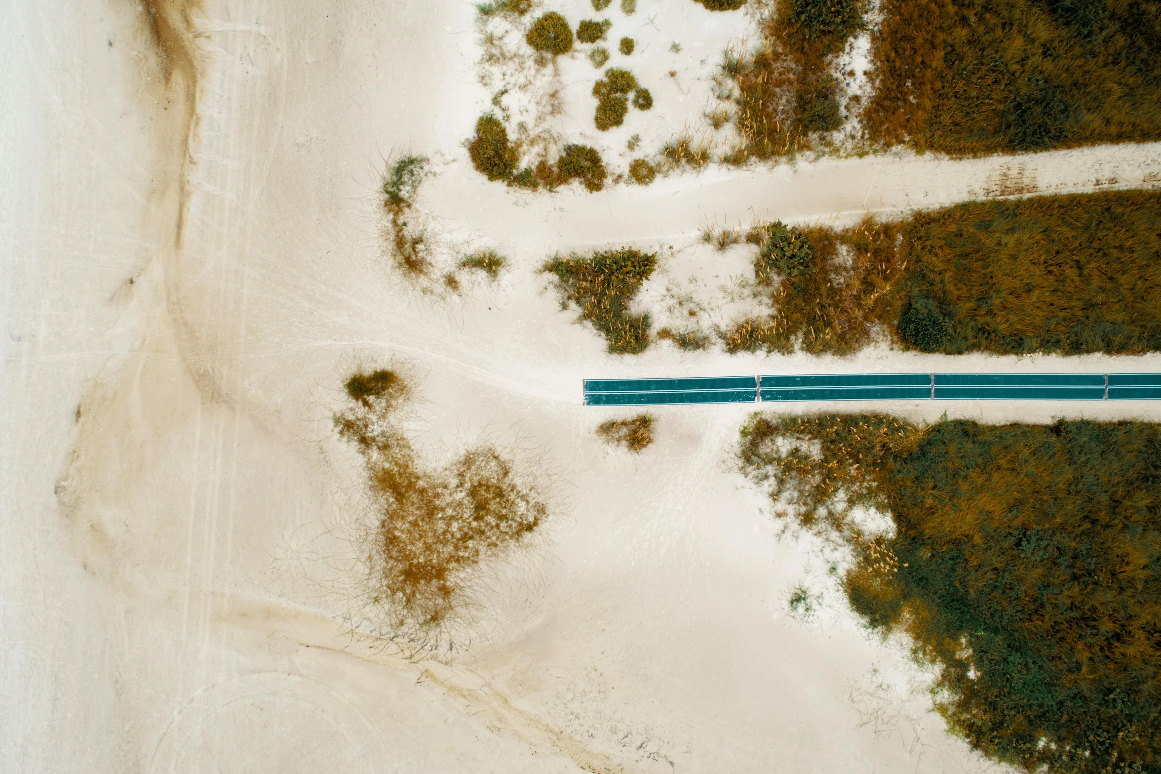 an aerial view of a road in the sand, inspired by Raoul De Keyser, unsplash contest winner, blue slide park, portrait n - 9, cyan, joel sternfeld