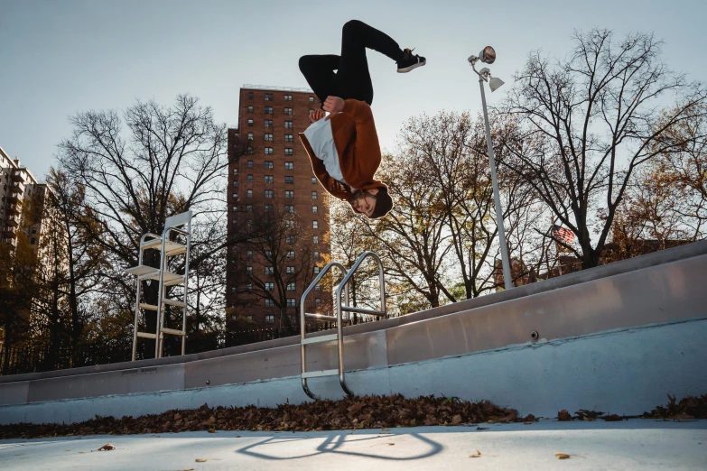 a man flying through the air while riding a skateboard, by William Berra, unsplash contest winner, graffiti, cold as ice! 🧊, male calisthenics, at a park, humans of new york