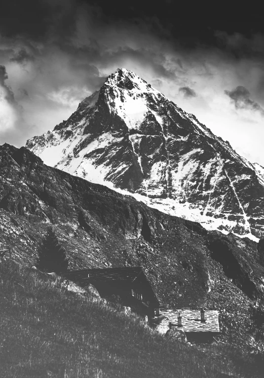 a black and white photo of a snow covered mountain, inspired by Otto Meyer-Amden, pyramid, uttarakhand, 1950s photograph, promo image